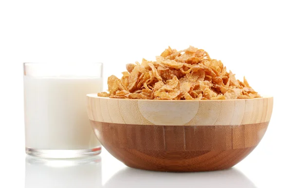 Tasty cornflakes in wooden bowl and glass of milk isolated on white — Stock Photo, Image
