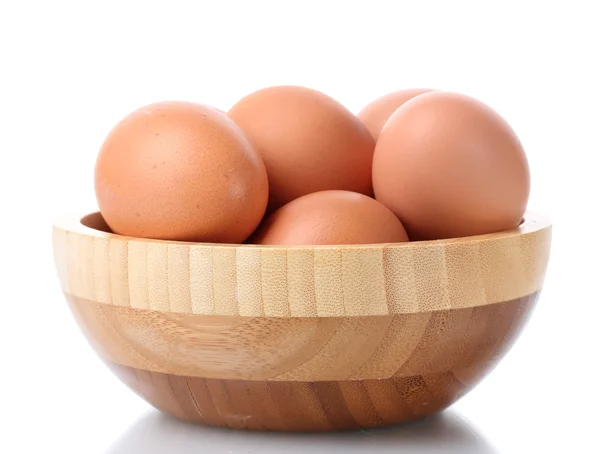 Stock image Brown eggs in wooden bowl isolated on white