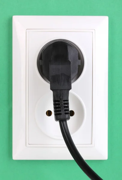 White electric socket with plug on the wall — Stock Photo, Image