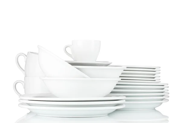 Üres tálak, tányérok és csészék, szürke háttér — Stock Fotó