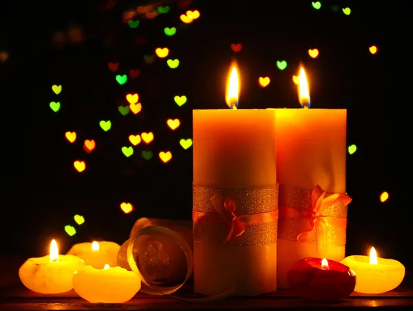 Beautiful candle and decor on wooden table on bright background — Stock Photo, Image