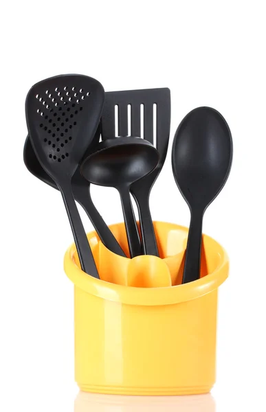 Černá kuchyňské nádobí v žlutý stánek izolovaných na bílém — Stock fotografie