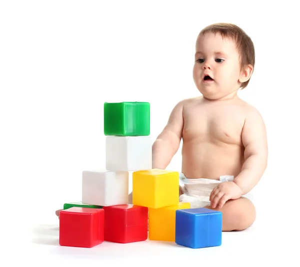 Cute baby girl playing with cubes isolated on white — Stock Photo, Image