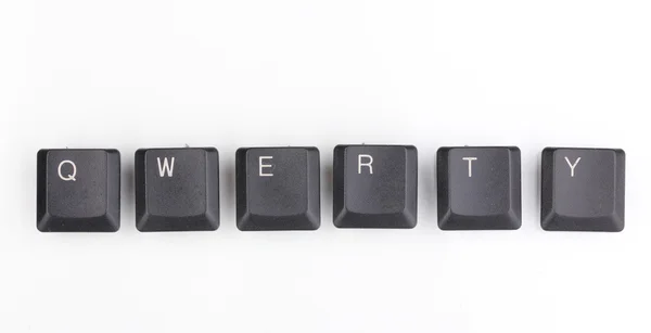 Клавіатурні клавіші, що говорять qwerty ізольовані на білому — стокове фото