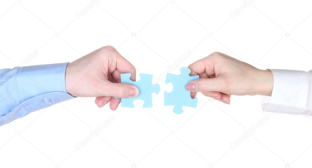 Hands with puzzle isolated on white