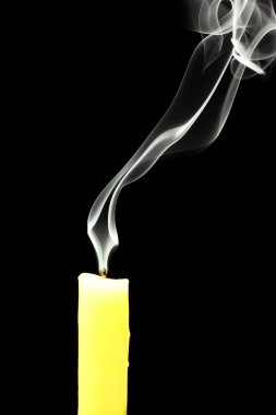 Candle with abstract smoke on black background clipart