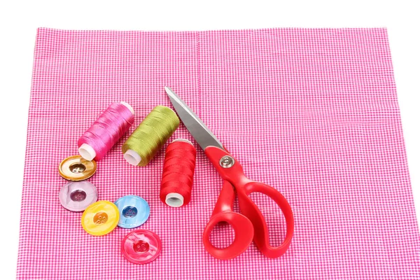 Scissors, buttons and bright threads on fabric isolated on white — Stock Photo, Image
