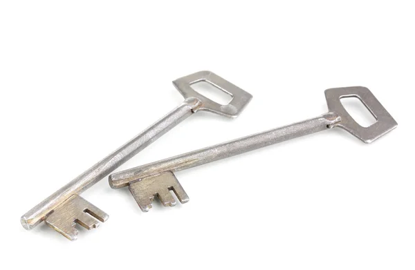 Due chiavi metalliche isolate su bianco — Foto Stock