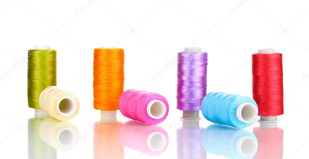 Many spools of thread isolated on white