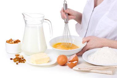 Female hands mixing eggs in bowl isolated on white clipart