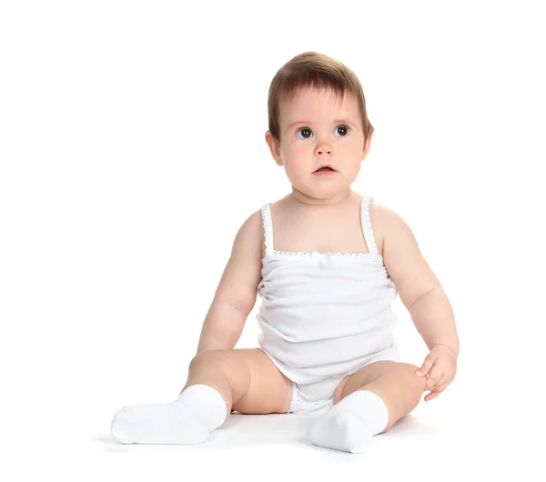 Cute baby girl sitting isolated on white — Stock Photo, Image