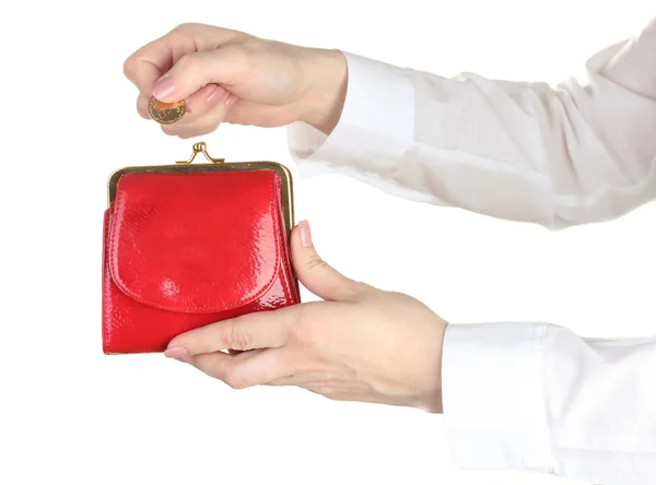 Vrouw hand gooien munt in tas geïsoleerd op wit — Stockfoto