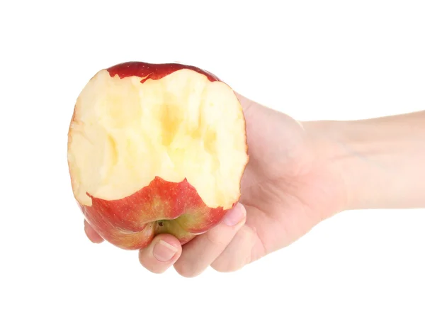 Czerwone jabłko ugryziony w rękę na białym tle — Zdjęcie stockowe