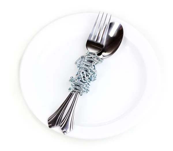 stock image Fork and spoon with chain on plate isolated on white