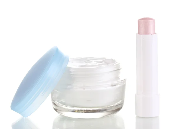 Lápiz labial higiénico y crema hidratante aislados en blanco — Foto de Stock