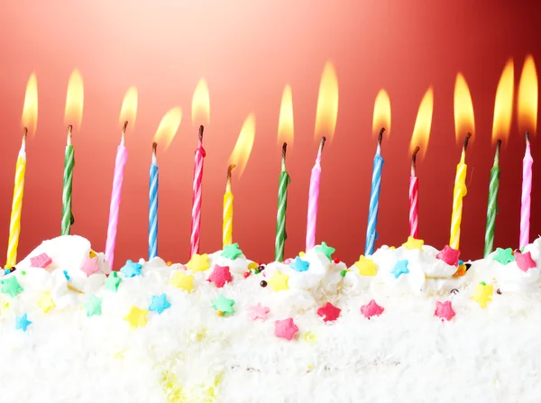 Beautiful birthday candles on red background — Stock Photo, Image
