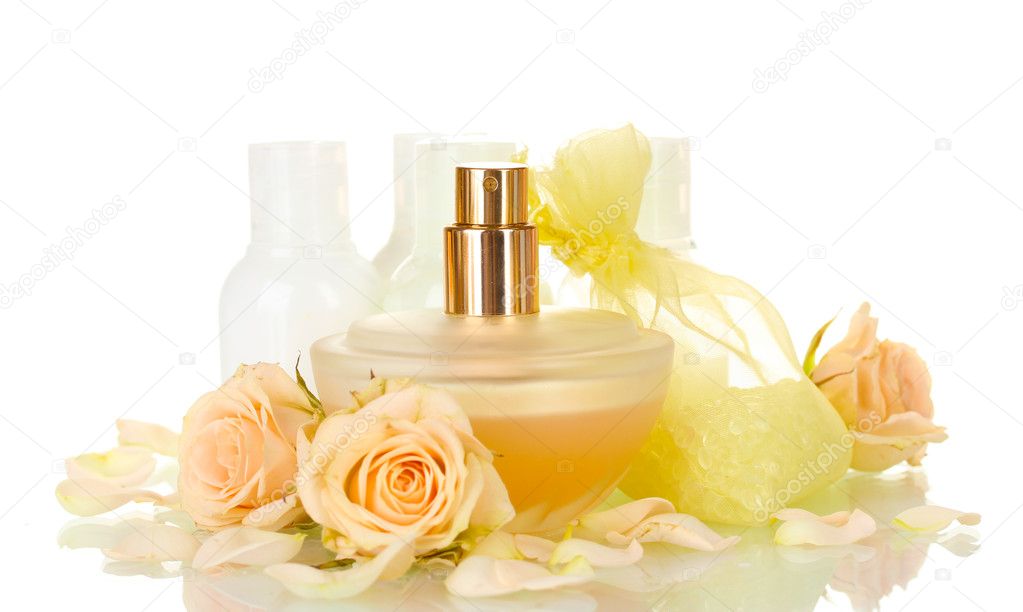 Hotel amenities kit and perfume on white background