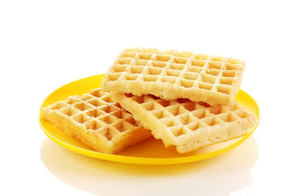 Waffles doces na placa isolada em branco — Fotografia de Stock