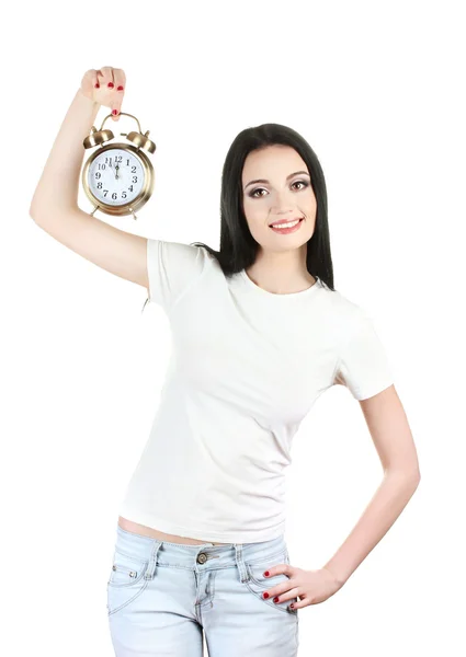 Bela jovem segurando despertador relógio isolado no branco — Fotografia de Stock