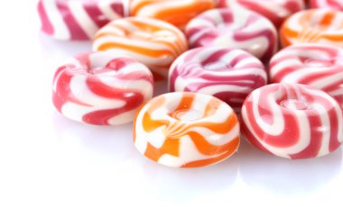 Striped fruit candies isolated on white clipart