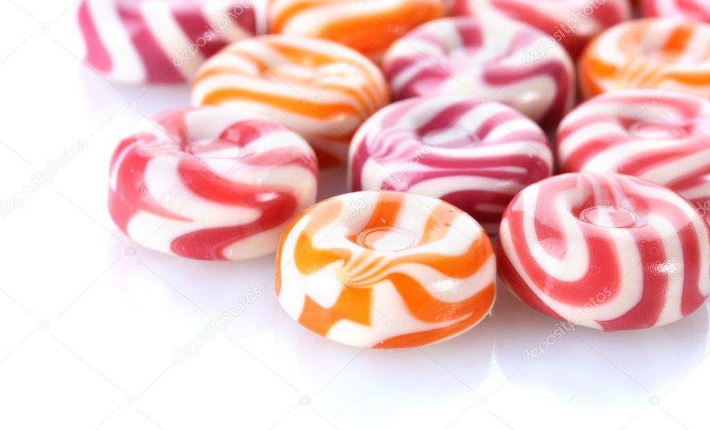 Striped fruit candies isolated on white