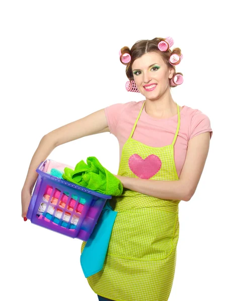 Beautiful young housewife with basket of folded laundry isolated on white — Stock Photo, Image