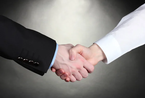 Business handshake on gray background — Stock Photo, Image