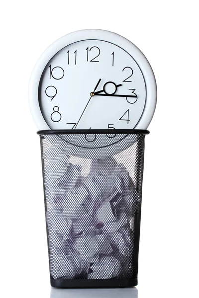 Wall Clock and paper in metal trash bin isolated on white — Stock Photo, Image