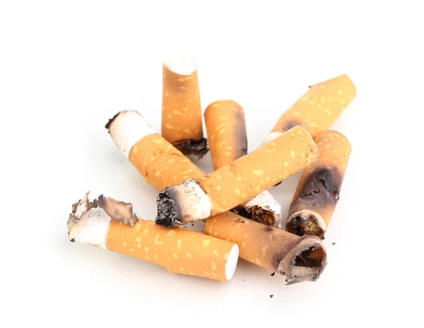 Colillas de cigarrillos aisladas en blanco —  Fotos de Stock