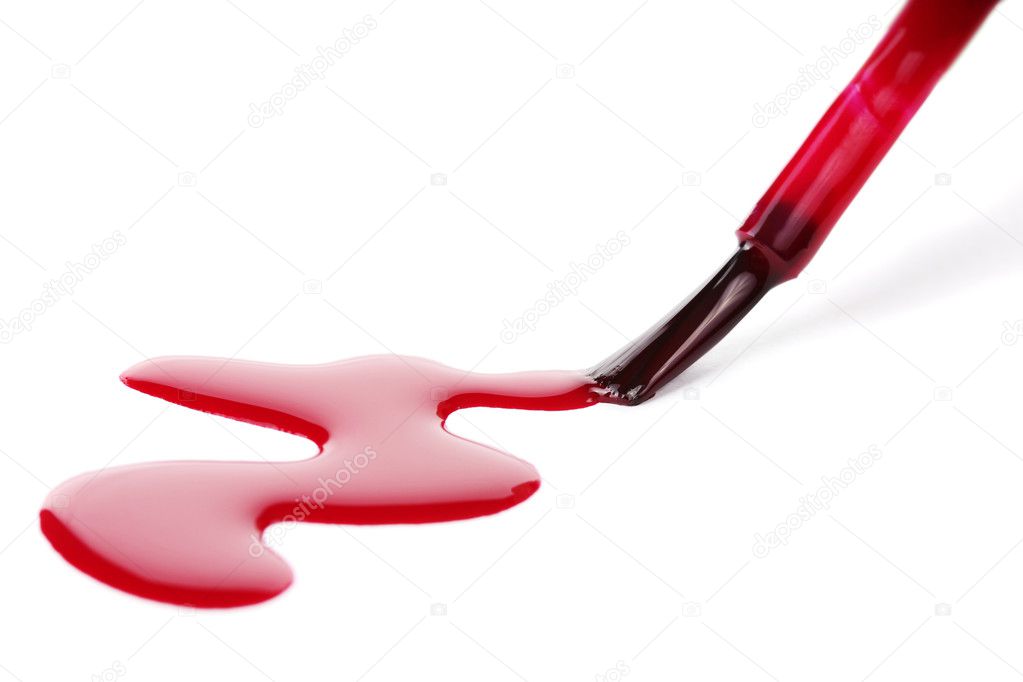 Red nail polish and brush isolated on white