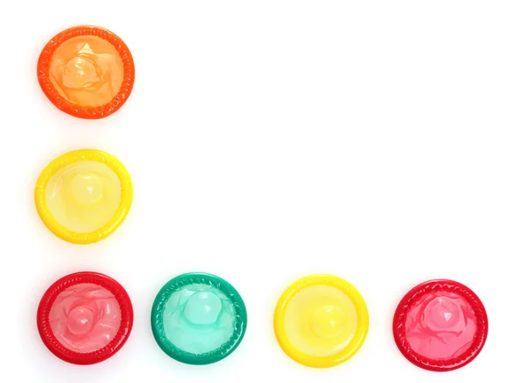 Preservativos coloridos aislados en blanco — Foto de Stock