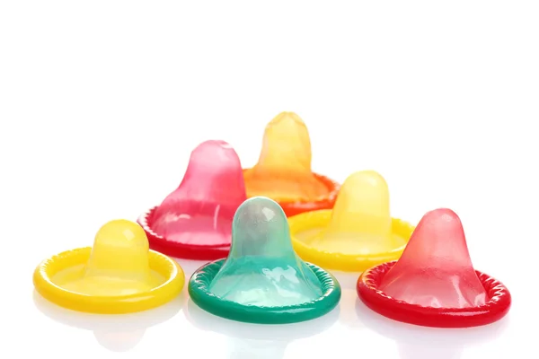 Colorful condoms isolated on white — Stock Photo, Image