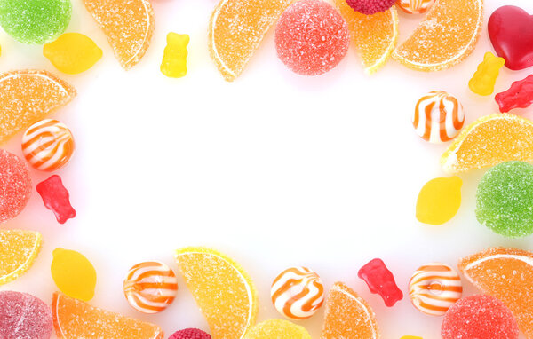 Frame of colorful jelly candies isolated on white