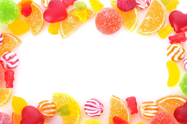 Frame of colorful jelly candies isolated on white