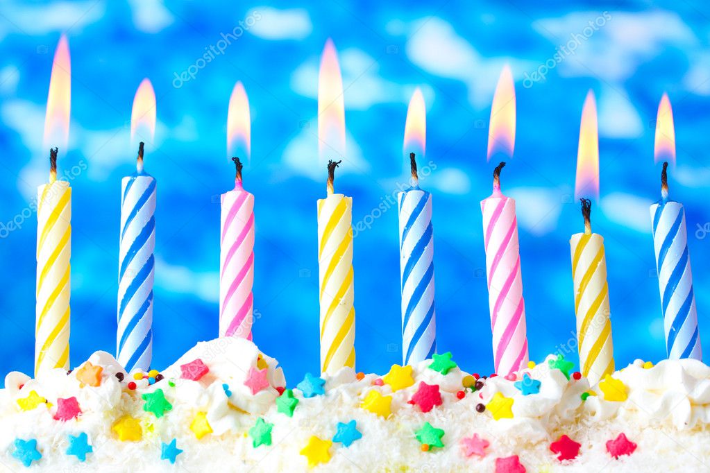 Beautiful birthday candles on blue background