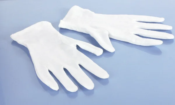 stock image Cloth gloves on blue background