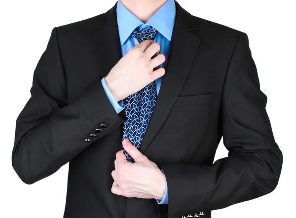 stock image Businessman correcting a tie close up