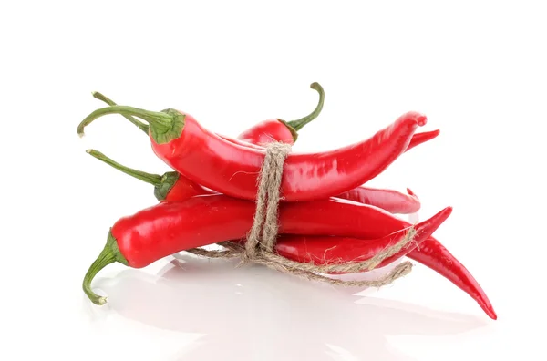 Red hot chili peppers tied with rope isolated on white — Stock Photo, Image
