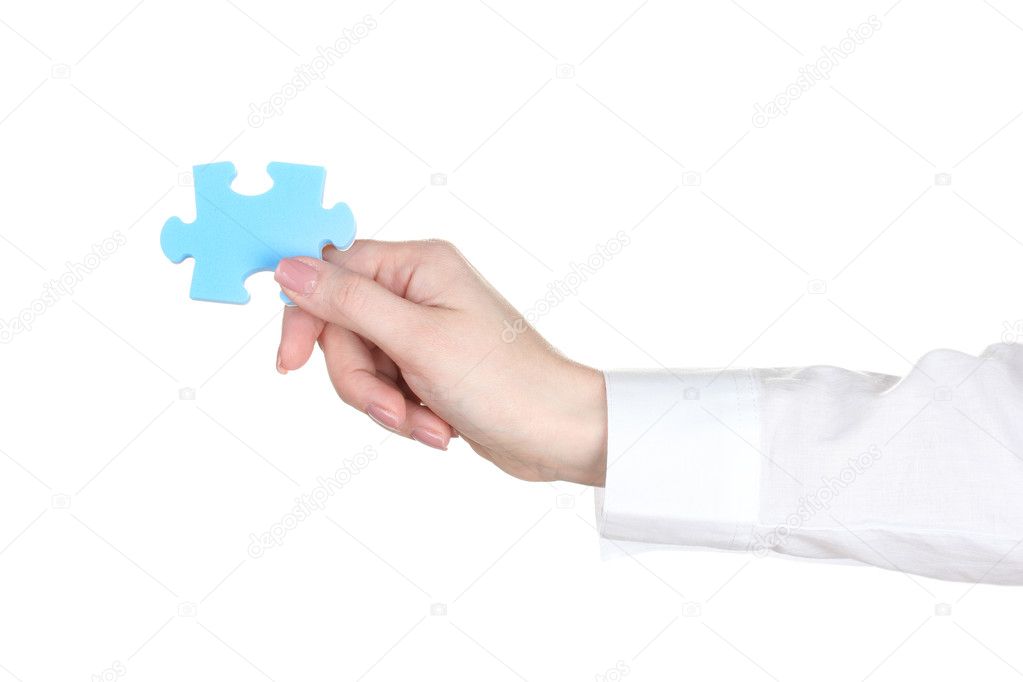 Woman hand holding puzzle isolated on white