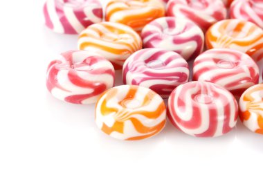 Striped fruit candies isolated on white clipart