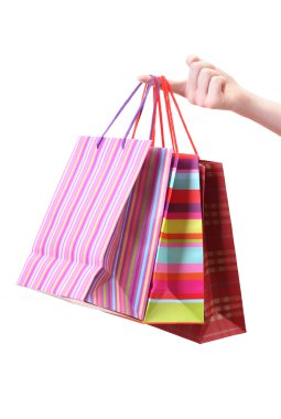 parlak alışveriş torbaları üzerinde beyaz izole tutmak el