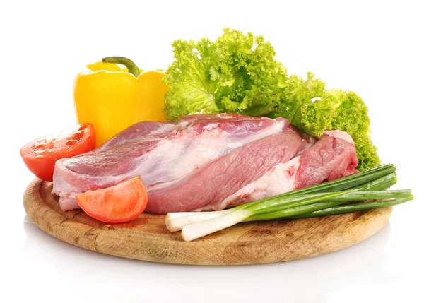 stock image Raw meat and vegetables on a wooden board isolated on whitе