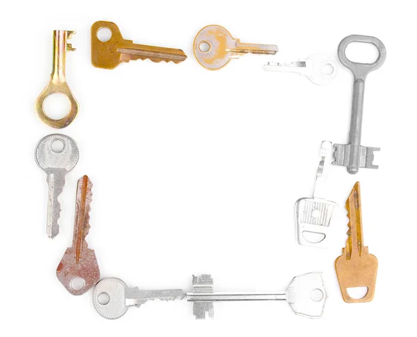 Muchas llaves de metal aisladas en blanco —  Fotos de Stock