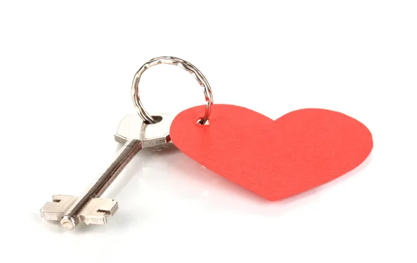 Nyckel med hjärtformad berlock isolerad på vit — Stockfoto