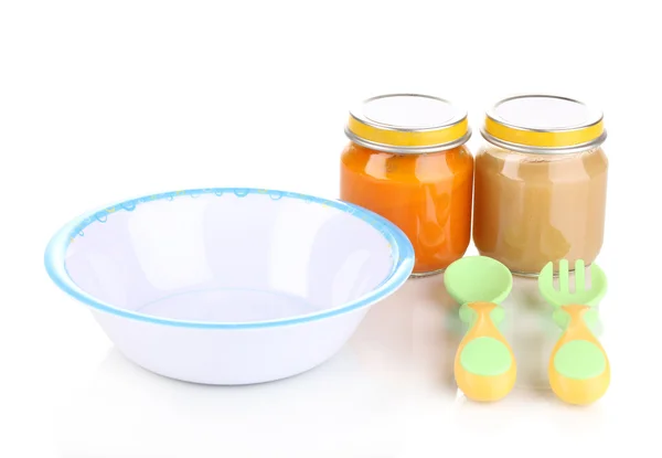 Jars of baby puree with plate, spoon and fork isolated on white — Stock Photo, Image