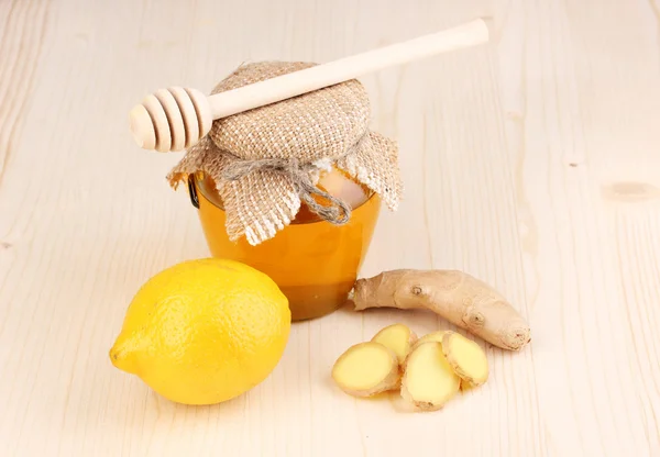 Ginger with lemon and honey on wooden background — Stock Photo, Image