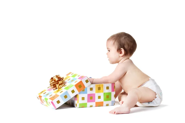 Cute baby girl and gift box isolated on white — Stock Photo, Image