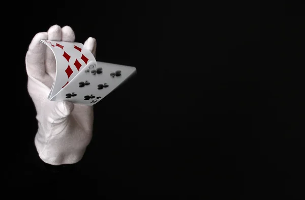 Cards in hand isolated on black — Stock Photo, Image