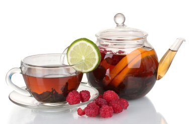 Black fruit tea in glass teapot and cup isolated on white clipart