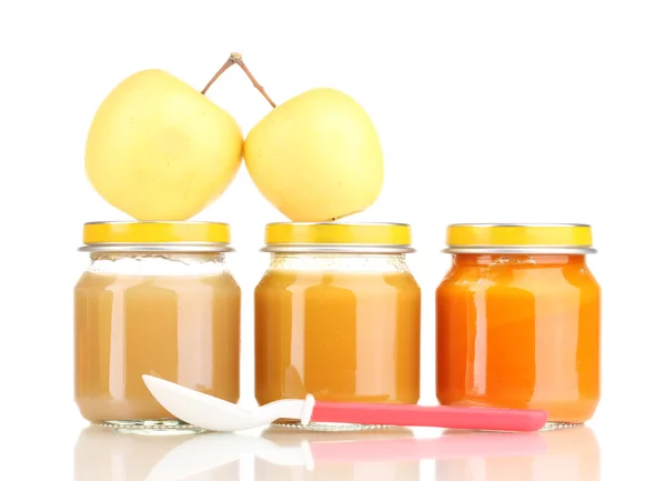 Jar of baby puree with apple and spoon isolated on white — Stock Photo, Image